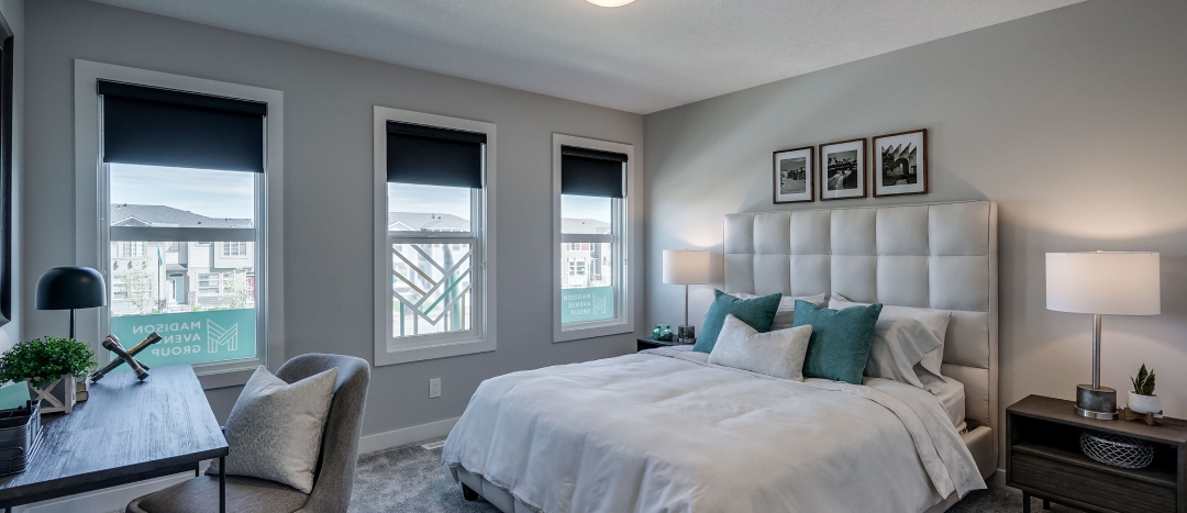 Furnished master bedroom in a Madison Avenue Group townhouse.