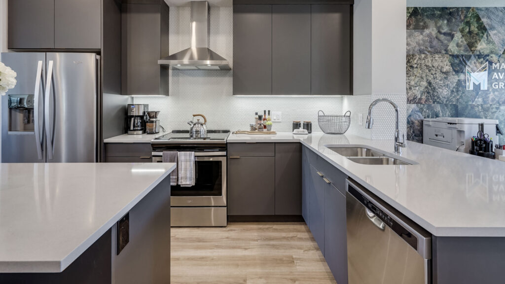 l shaped kitchen with an island in a madison avenue group townhome