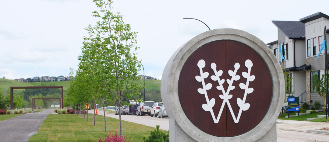 A concrete sign of the Wolf Willow logo in Promenade Park.