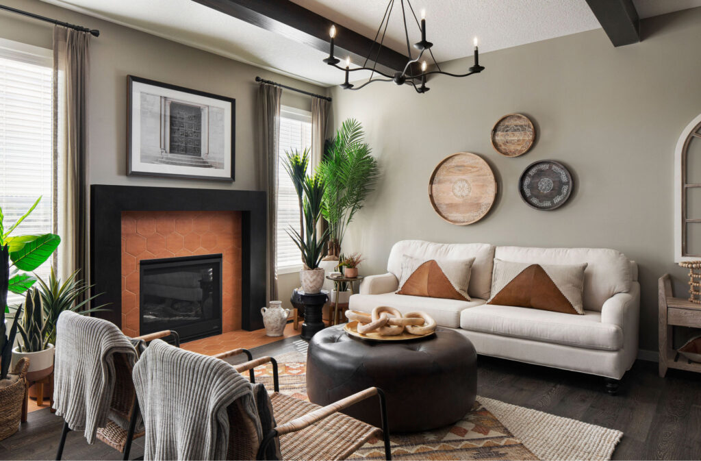 living room with a black and orange fireplace, dark wood accents, and neutral furniture